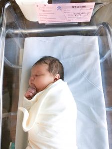 Newborn Girl in Hospital Bassinet