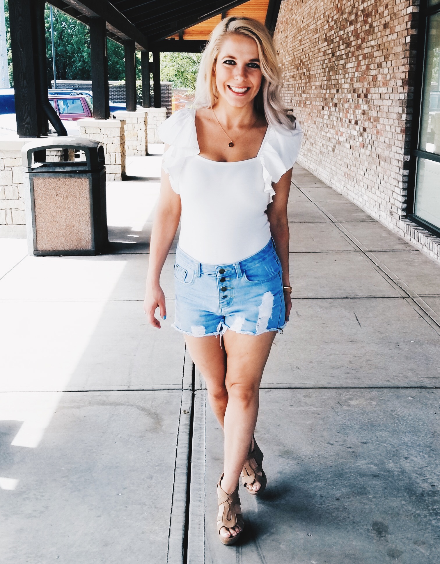 Stylish Summer Outfit with White Bodysuit and Denim Shorts